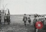 Image of US Army troops and band marching with flag during training United States USA, 1916, second 19 stock footage video 65675022632