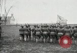Image of US Army troops and band marching with flag during training United States USA, 1916, second 26 stock footage video 65675022632