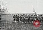 Image of US Army troops and band marching with flag during training United States USA, 1916, second 27 stock footage video 65675022632
