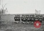 Image of US Army troops and band marching with flag during training United States USA, 1916, second 28 stock footage video 65675022632