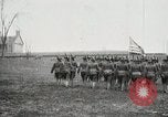Image of US Army troops and band marching with flag during training United States USA, 1916, second 29 stock footage video 65675022632