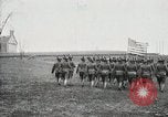 Image of US Army troops and band marching with flag during training United States USA, 1916, second 30 stock footage video 65675022632