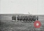 Image of US Army troops and band marching with flag during training United States USA, 1916, second 34 stock footage video 65675022632