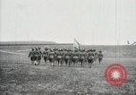 Image of US Army troops and band marching with flag during training United States USA, 1916, second 36 stock footage video 65675022632