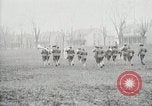 Image of US Army troops and band marching with flag during training United States USA, 1916, second 56 stock footage video 65675022632
