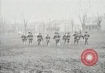 Image of US Army troops and band marching with flag during training United States USA, 1916, second 57 stock footage video 65675022632