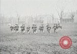 Image of US Army troops and band marching with flag during training United States USA, 1916, second 58 stock footage video 65675022632