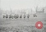 Image of US Army troops and band marching with flag during training United States USA, 1916, second 59 stock footage video 65675022632