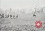 Image of US Army troops and band marching with flag during training United States USA, 1916, second 62 stock footage video 65675022632