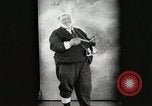 Image of Fat man playing tiny drum vintage humor United States USA, 1916, second 1 stock footage video 65675022634