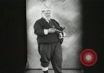 Image of Fat man playing tiny drum vintage humor United States USA, 1916, second 3 stock footage video 65675022634