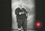 Image of Fat man playing tiny drum vintage humor United States USA, 1916, second 5 stock footage video 65675022634