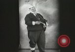 Image of Fat man playing tiny drum vintage humor United States USA, 1916, second 7 stock footage video 65675022634