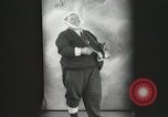 Image of Fat man playing tiny drum vintage humor United States USA, 1916, second 9 stock footage video 65675022634