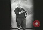 Image of Fat man playing tiny drum vintage humor United States USA, 1916, second 10 stock footage video 65675022634