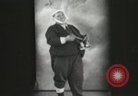 Image of Fat man playing tiny drum vintage humor United States USA, 1916, second 12 stock footage video 65675022634