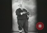 Image of Fat man playing tiny drum vintage humor United States USA, 1916, second 13 stock footage video 65675022634