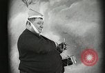 Image of Fat man playing tiny drum vintage humor United States USA, 1916, second 25 stock footage video 65675022634