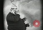 Image of Fat man playing tiny drum vintage humor United States USA, 1916, second 26 stock footage video 65675022634