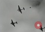 Image of 187th Regimental Combat Team parachutes onto field  Korea, 1951, second 10 stock footage video 65675022702