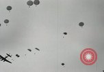 Image of 187th Regimental Combat Team parachutes onto field  Korea, 1951, second 15 stock footage video 65675022702