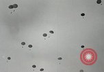 Image of 187th Regimental Combat Team parachutes onto field  Korea, 1951, second 19 stock footage video 65675022702