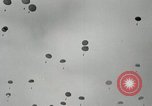 Image of 187th Regimental Combat Team parachutes onto field  Korea, 1951, second 22 stock footage video 65675022702