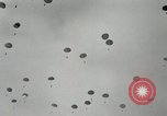 Image of 187th Regimental Combat Team parachutes onto field  Korea, 1951, second 23 stock footage video 65675022702