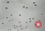 Image of 187th Regimental Combat Team parachutes onto field  Korea, 1951, second 25 stock footage video 65675022702