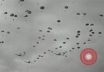 Image of 187th Regimental Combat Team parachutes onto field  Korea, 1951, second 29 stock footage video 65675022702