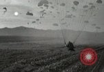 Image of 187th Regimental Combat Team parachutes onto field  Korea, 1951, second 39 stock footage video 65675022702