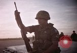 Image of 173rd Airborne Brigade troops Vietnam Bien Hoa Air Base, 1965, second 33 stock footage video 65675022738