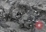 Image of Medics tend to wounded U.S. soldiers on beach Normandy France, 1944, second 9 stock footage video 65675022977