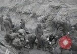 Image of Medics tend to wounded U.S. soldiers on beach Normandy France, 1944, second 12 stock footage video 65675022977