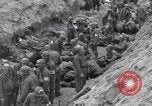 Image of Medics tend to wounded U.S. soldiers on beach Normandy France, 1944, second 25 stock footage video 65675022977