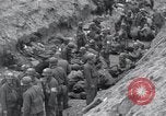 Image of Medics tend to wounded U.S. soldiers on beach Normandy France, 1944, second 26 stock footage video 65675022977