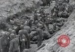 Image of Medics tend to wounded U.S. soldiers on beach Normandy France, 1944, second 27 stock footage video 65675022977