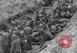 Image of Medics tend to wounded U.S. soldiers on beach Normandy France, 1944, second 28 stock footage video 65675022977