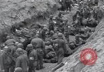 Image of Medics tend to wounded U.S. soldiers on beach Normandy France, 1944, second 30 stock footage video 65675022977