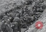 Image of Medics tend to wounded U.S. soldiers on beach Normandy France, 1944, second 31 stock footage video 65675022977