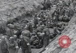 Image of Medics tend to wounded U.S. soldiers on beach Normandy France, 1944, second 33 stock footage video 65675022977