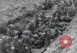 Image of Medics tend to wounded U.S. soldiers on beach Normandy France, 1944, second 34 stock footage video 65675022977