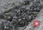 Image of Medics tend to wounded U.S. soldiers on beach Normandy France, 1944, second 35 stock footage video 65675022977