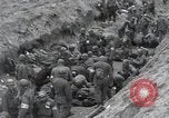 Image of Medics tend to wounded U.S. soldiers on beach Normandy France, 1944, second 36 stock footage video 65675022977