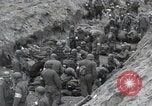 Image of Medics tend to wounded U.S. soldiers on beach Normandy France, 1944, second 37 stock footage video 65675022977