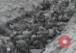 Image of Medics tend to wounded U.S. soldiers on beach Normandy France, 1944, second 40 stock footage video 65675022977