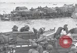 Image of Medics tend to wounded U.S. soldiers on beach Normandy France, 1944, second 42 stock footage video 65675022977