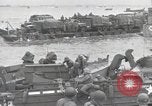 Image of Medics tend to wounded U.S. soldiers on beach Normandy France, 1944, second 43 stock footage video 65675022977