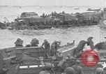 Image of Medics tend to wounded U.S. soldiers on beach Normandy France, 1944, second 44 stock footage video 65675022977
