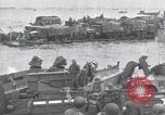 Image of Medics tend to wounded U.S. soldiers on beach Normandy France, 1944, second 46 stock footage video 65675022977